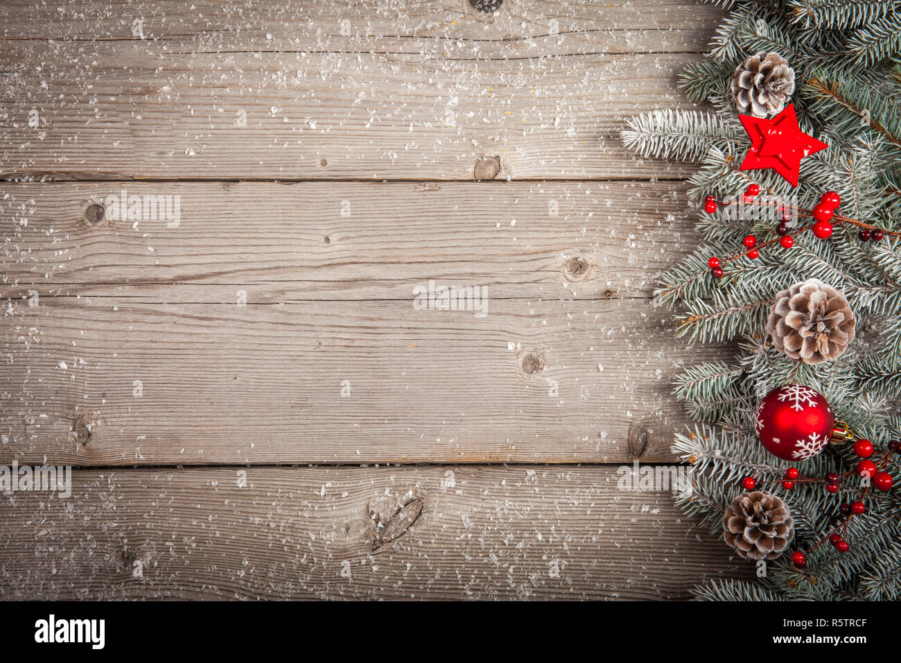 Christmas grunge wooden background with snow fir tree. Top view with ...