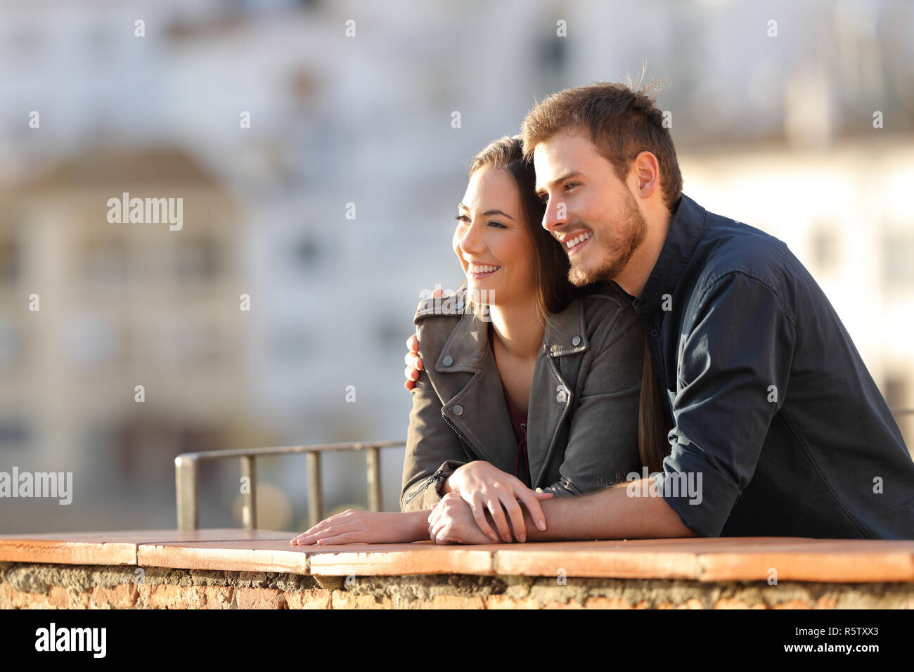 Woman watching sunset balcony hi-res stock photography and images - Alamy
