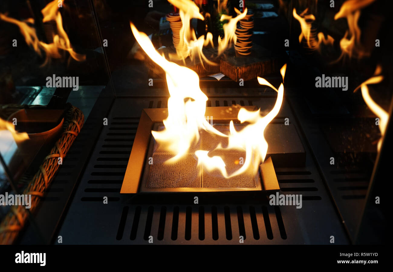 Exploding flames black background. Fireplace with just like fire ...