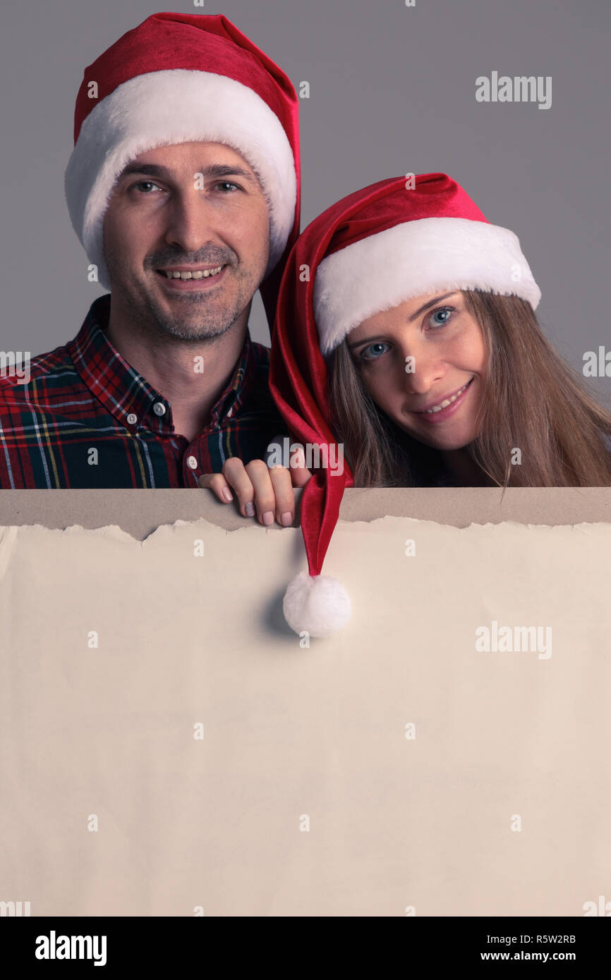 Men in santa hats holding hi-res stock photography and images - Alamy