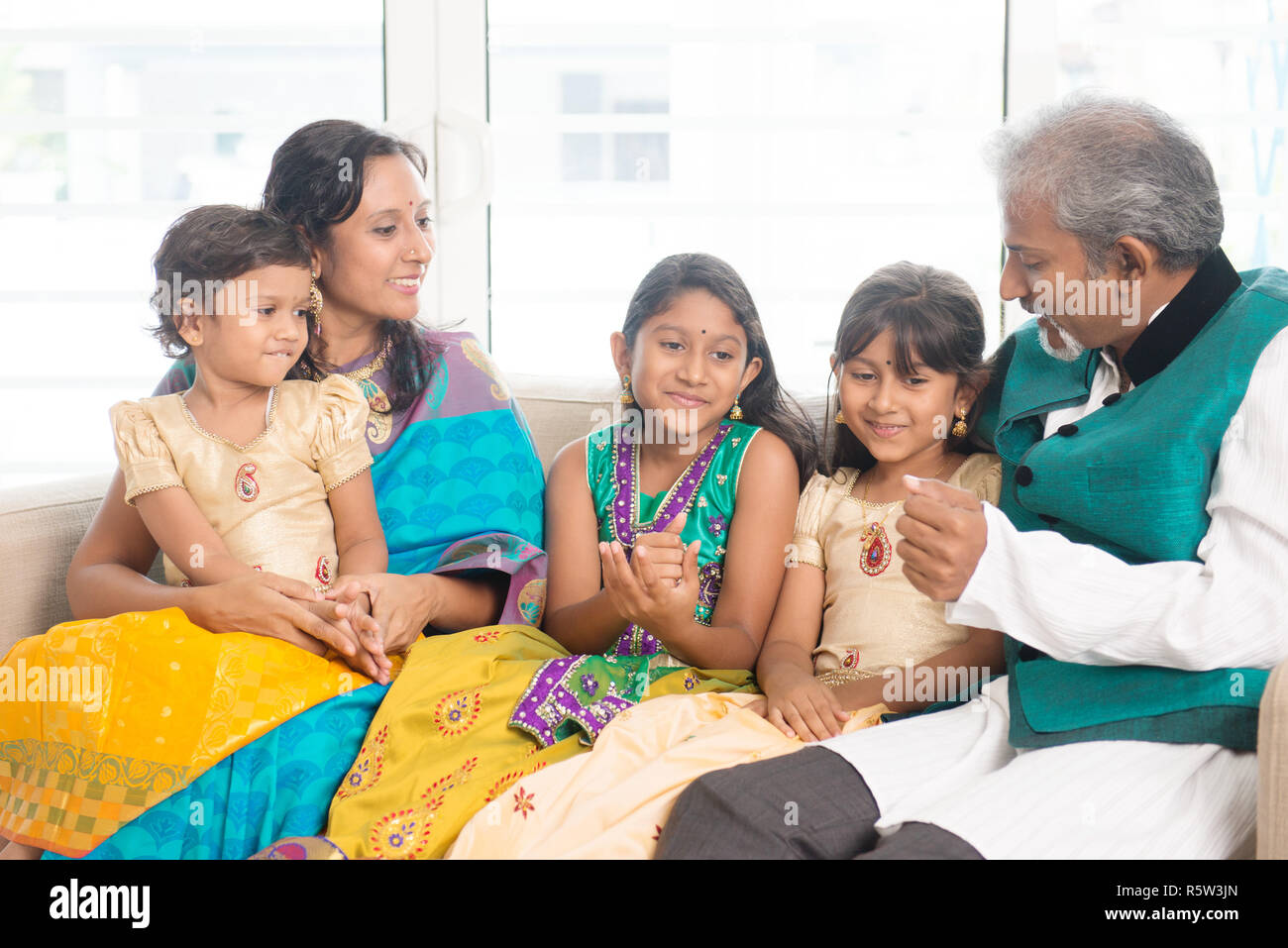 Happy Indian family indoors Stock Photo - Alamy