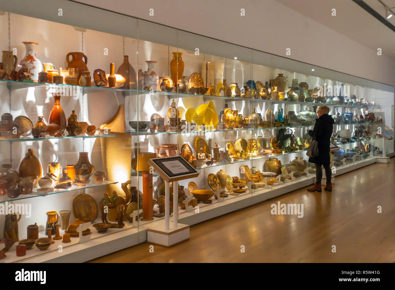 A woman admiring part of the extensive permanent collection of Ceramic Art at Award Winning York Art Gallery Stock Photo