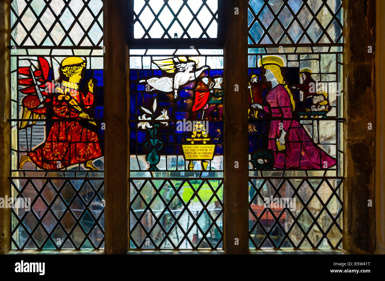 Interior of the Merchant Adventurers' Hall showing a stained glass window depicting the Annunciation in the Undercroft on the ground floor Stock Photo