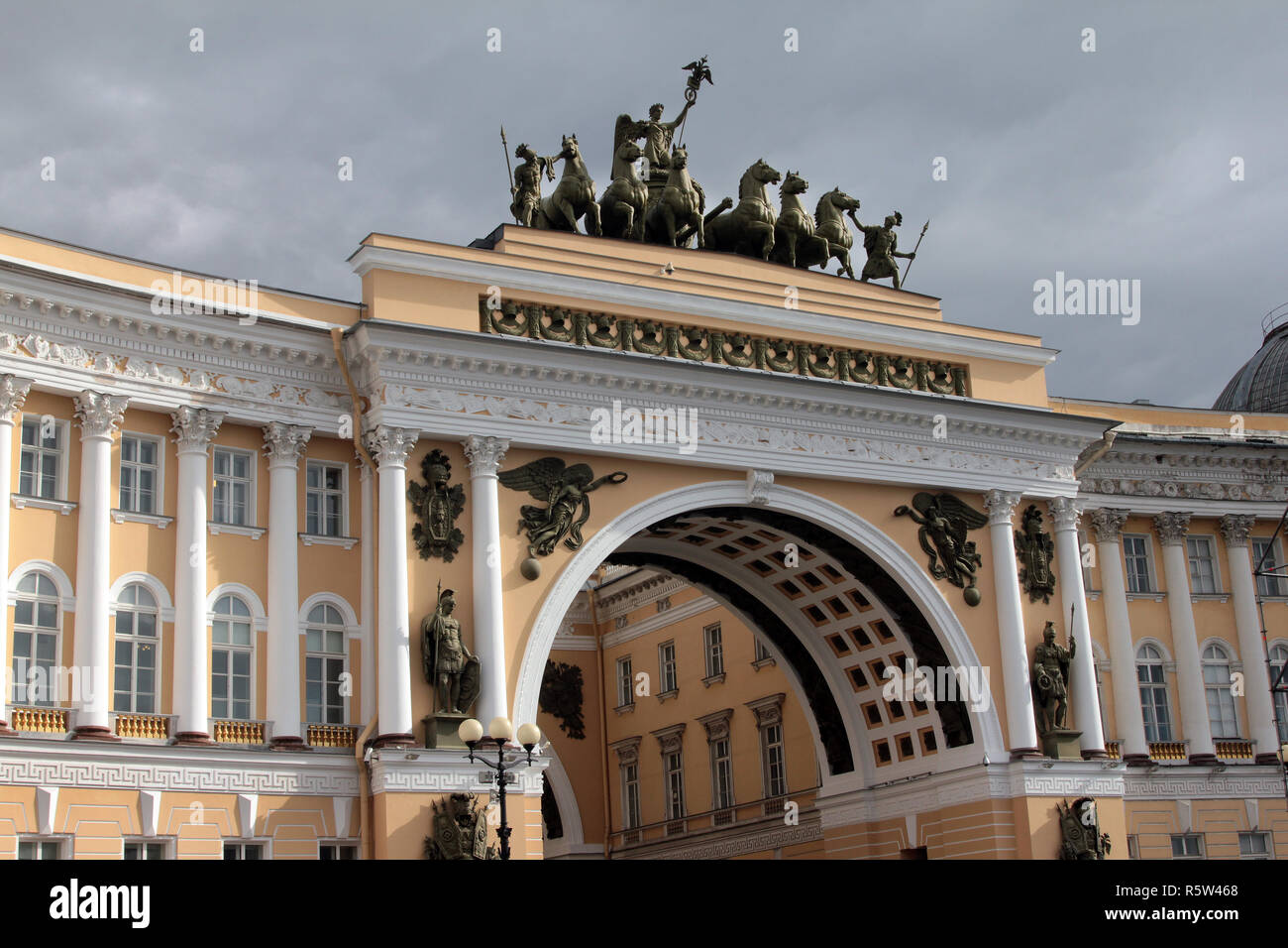 This magnificent building is the General Staff Building and this is the grand entrance to it, with a double arch and a statue of Victory, on her chariot, on top. It is now an overspill from the Hermitage and houses 19th and 20th century paintings in St Petersburg in Russia. Stock Photo