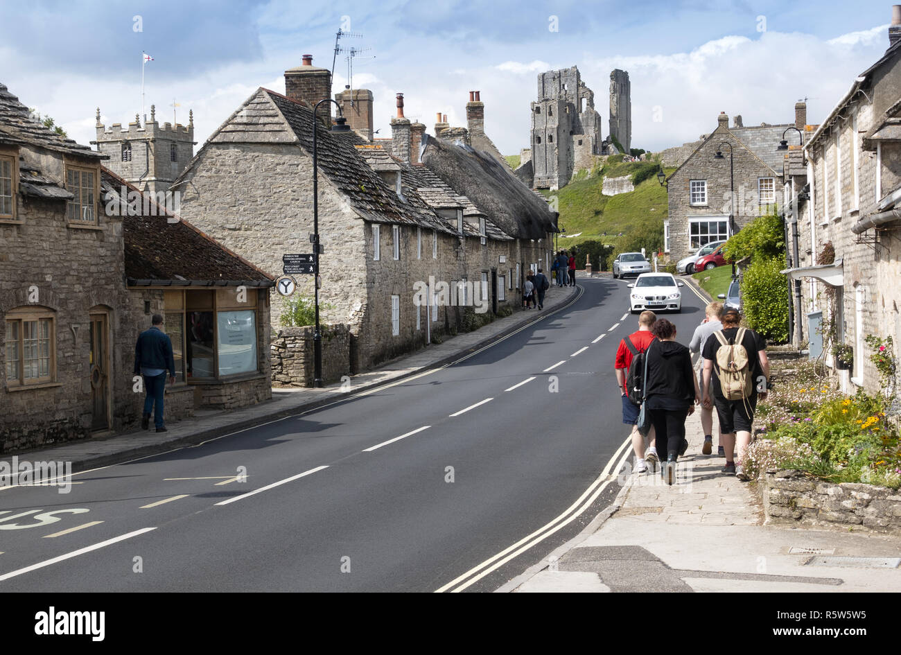 Corfe Castle and village on the Isle of Purbeck, Dorset, England, UK Stock Photo