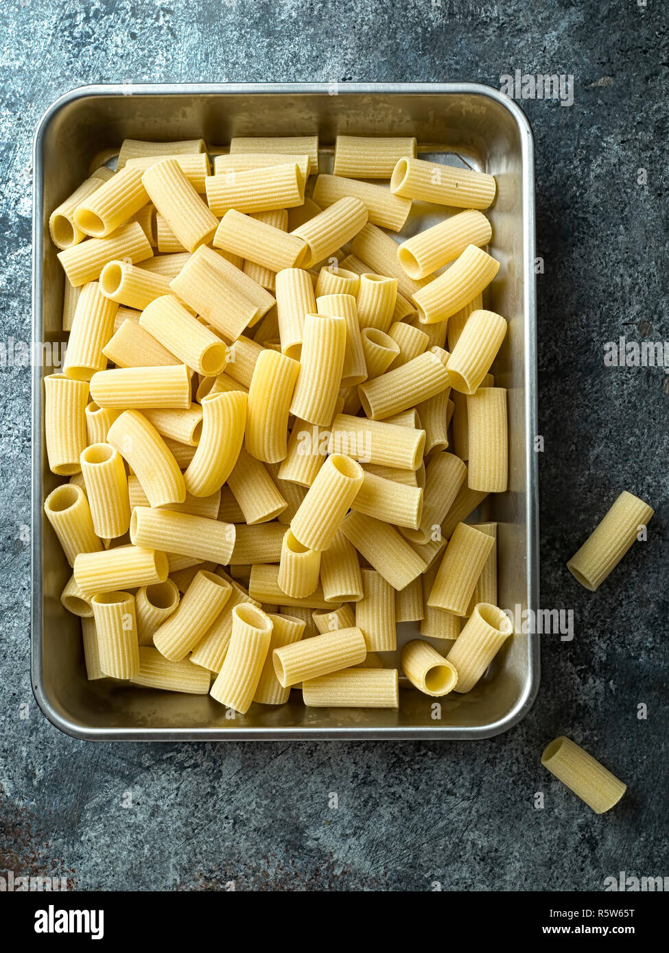 rustic uncooked italian rigatoni pasta Stock Photo - Alamy