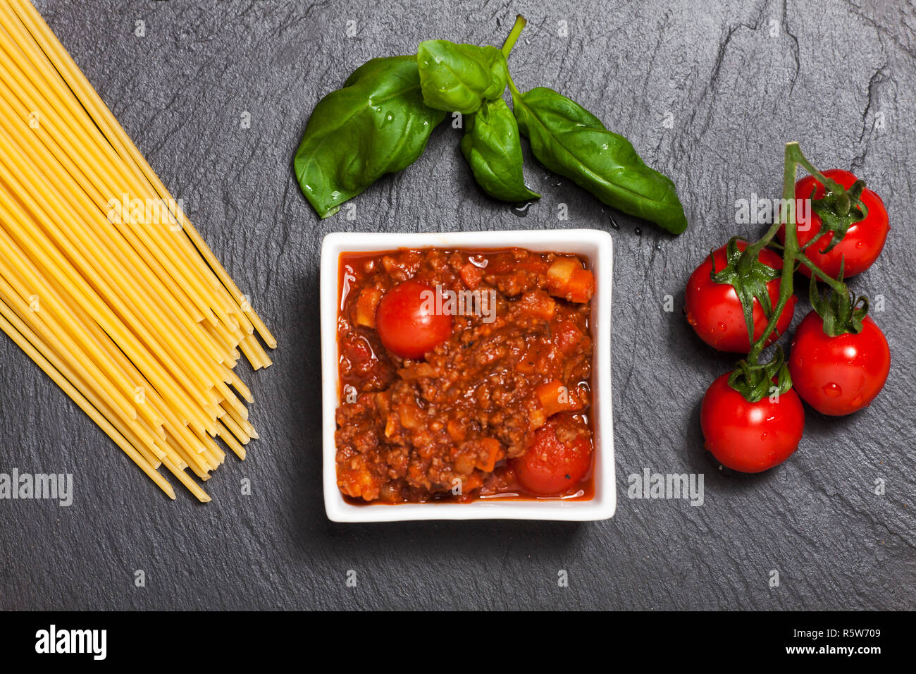 raw spaghetti on black slate Stock Photo