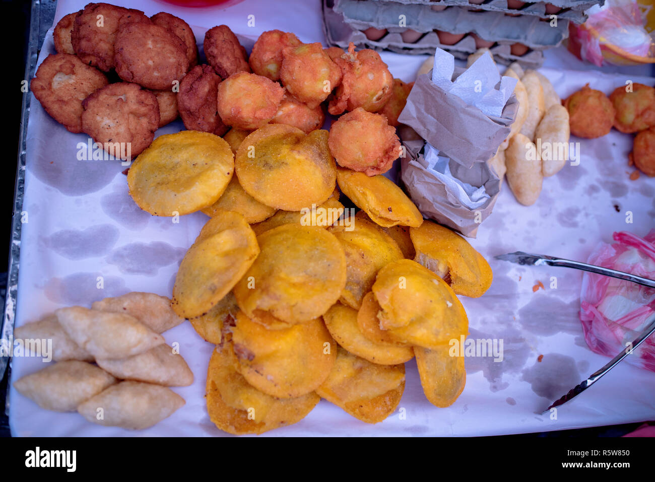 Fried street food for sale in the old town of Cartagena de Indias, Colombia. Yuca, potato, patacones and eggs. Oct 2018 Stock Photo