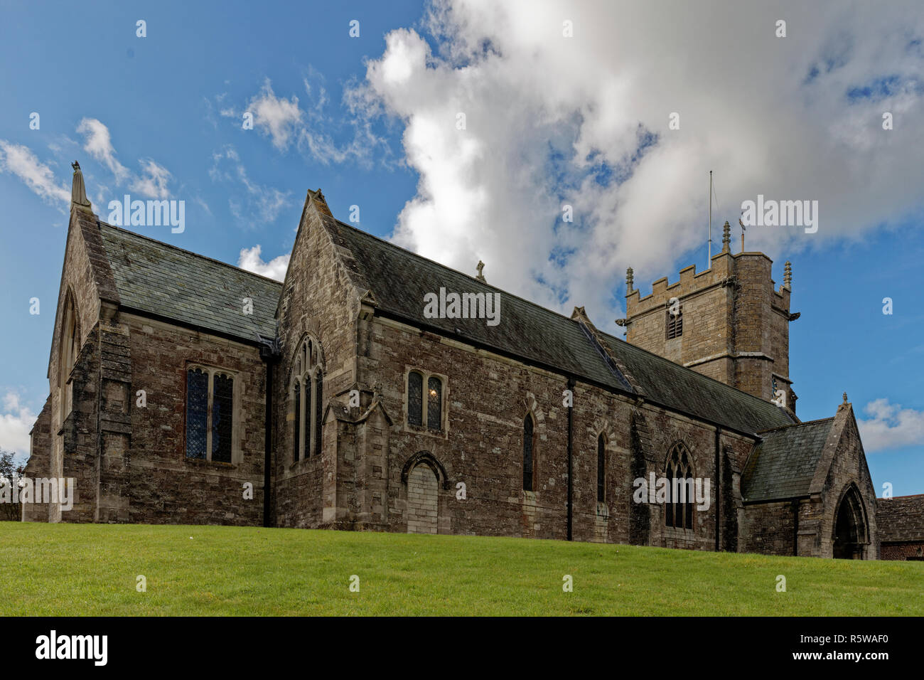 The old village church in Corfe Castle village, Dorset on a sunny day Stock Photo