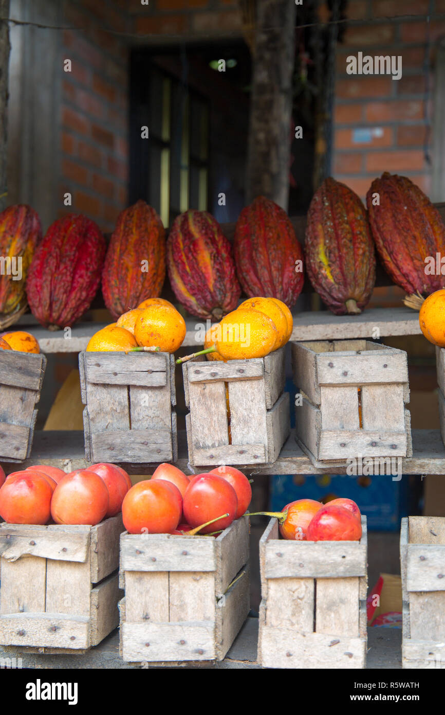 Boxes of Tree Tomato and Granadilla for sale at roadside fruit stall