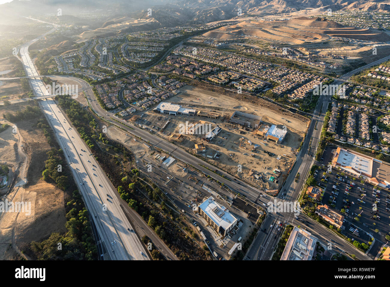 Late afternoon aerial view of shopping center construction, Rinaldi Street and the 118 freeway in the Porter Ranch community of Los Angeles, Californi Stock Photo