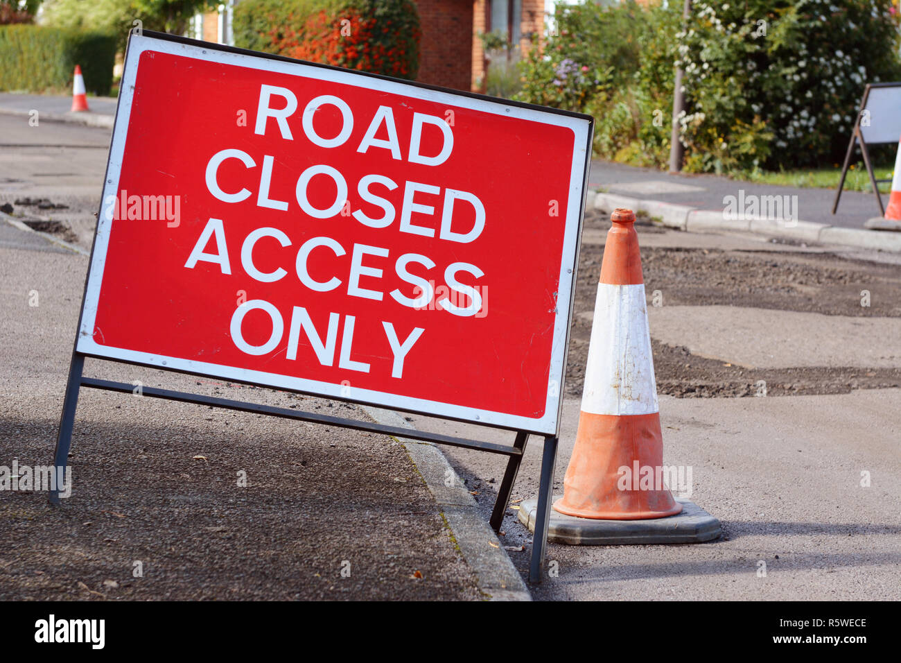 road-closed-access-only-road-sign-with-a-traffic-cone-stock-photo-alamy