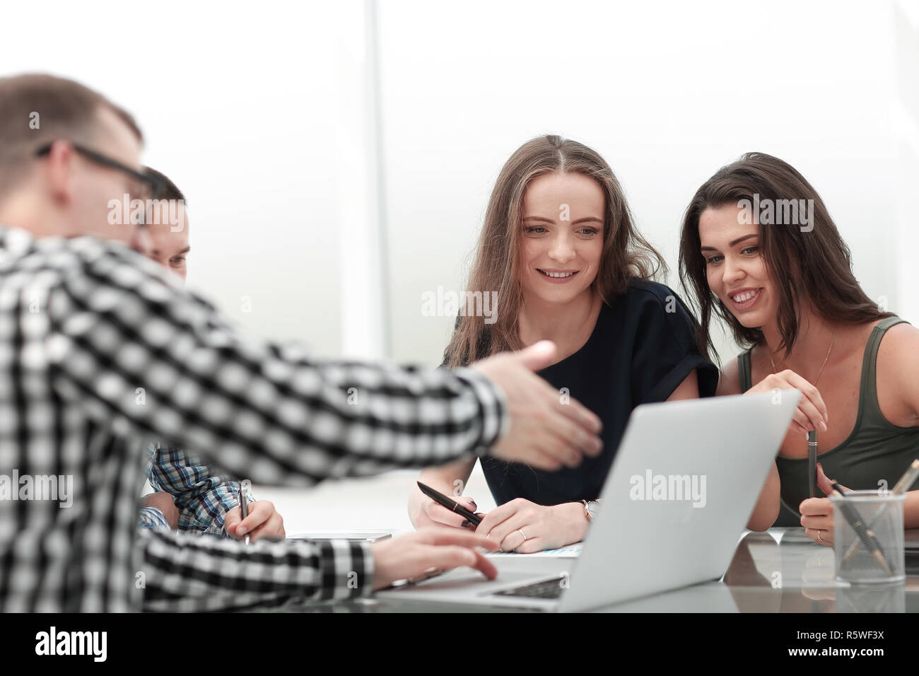 business team using laptop to view current news. Stock Photo