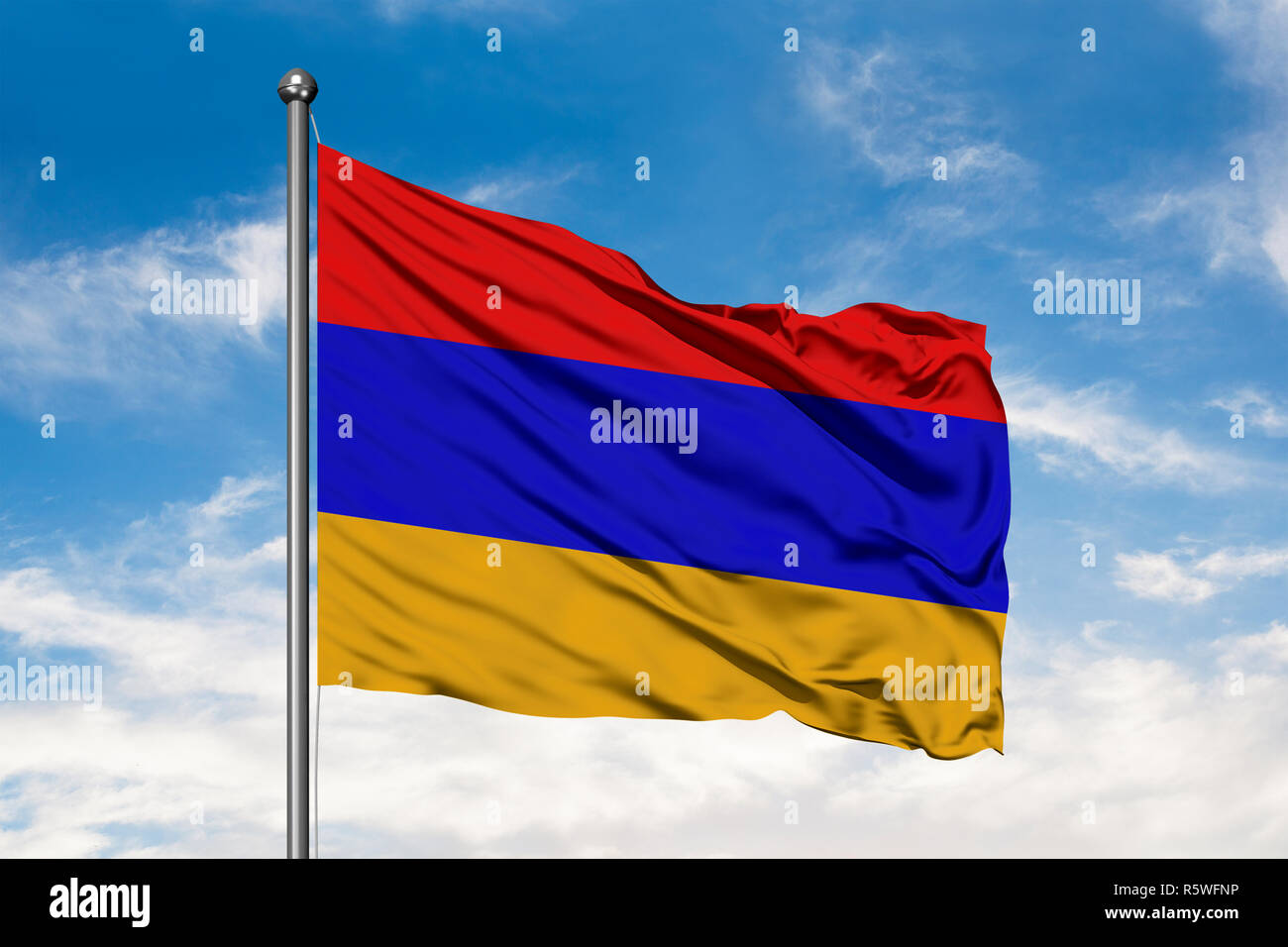 Flag of Armenia waving in the wind against white cloudy blue sky ...
