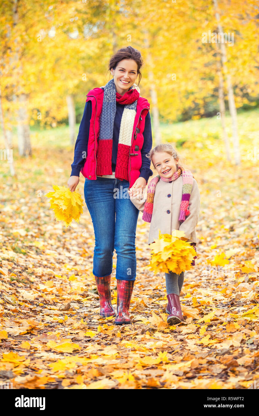 Mother and daughter in the autumn park Stock Photo - Alamy