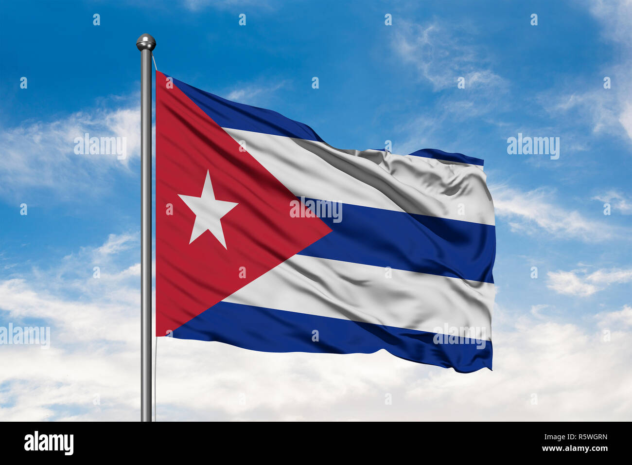 Flag of Cuba waving in the wind against white cloudy blue sky. Cuban ...