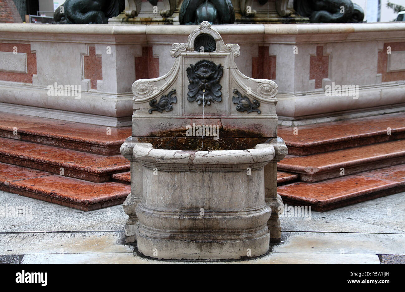 Drinking water fountain next to the Fountain of Neptune in Bologna