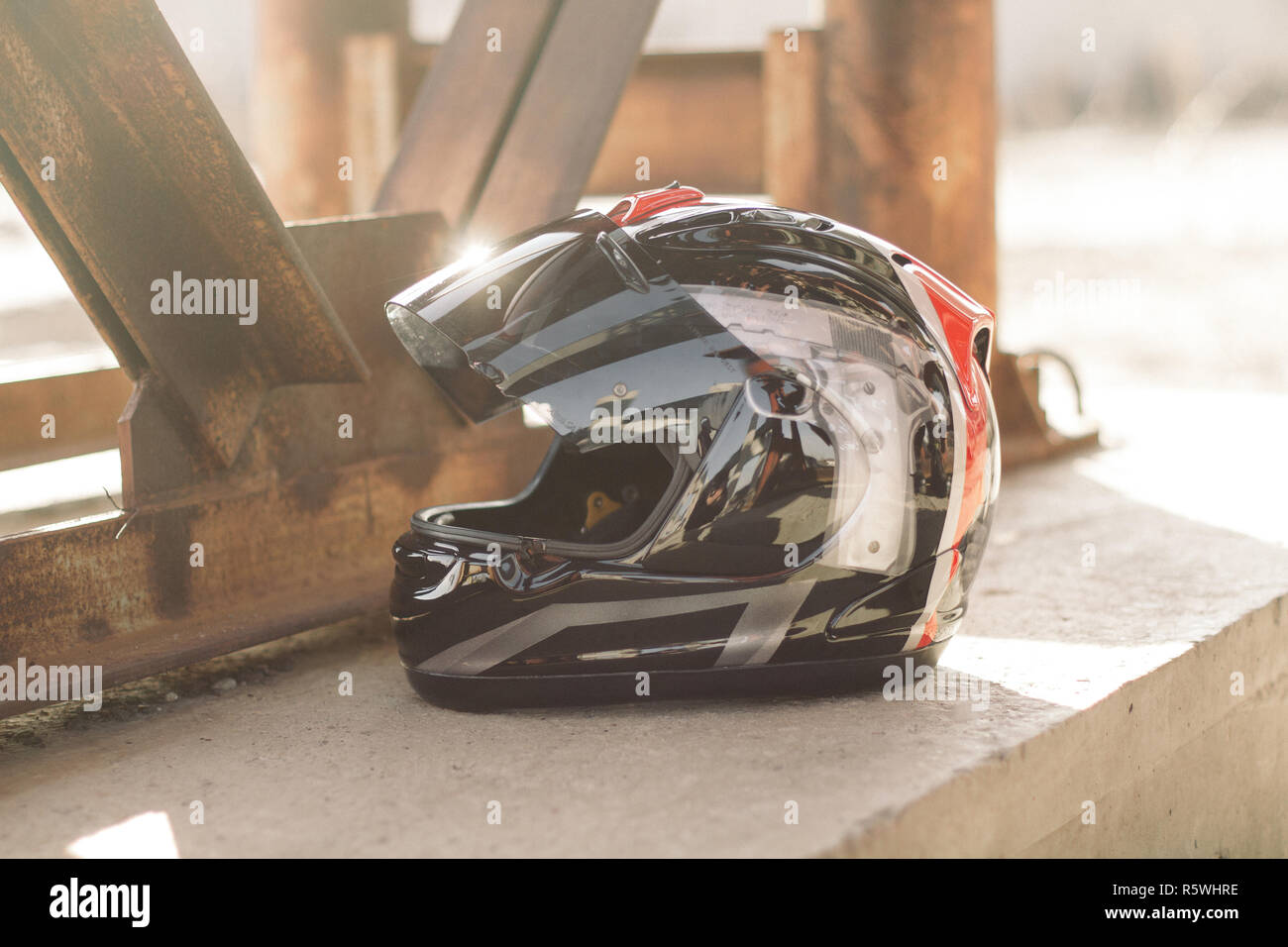 Modern motorcycle helmet on urban bright background Stock Photo Alamy