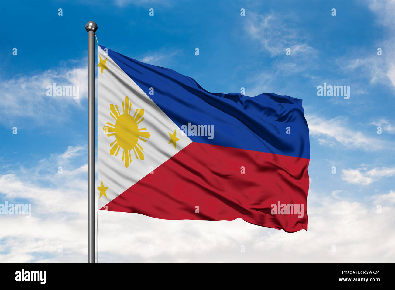 Flag of Philippines waving in the wind against white cloudy blue sky ...