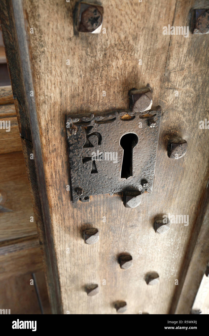 Large church lock with makers mark - h t. Ironwork, bolts, nuts, nut heads. Stock Photo