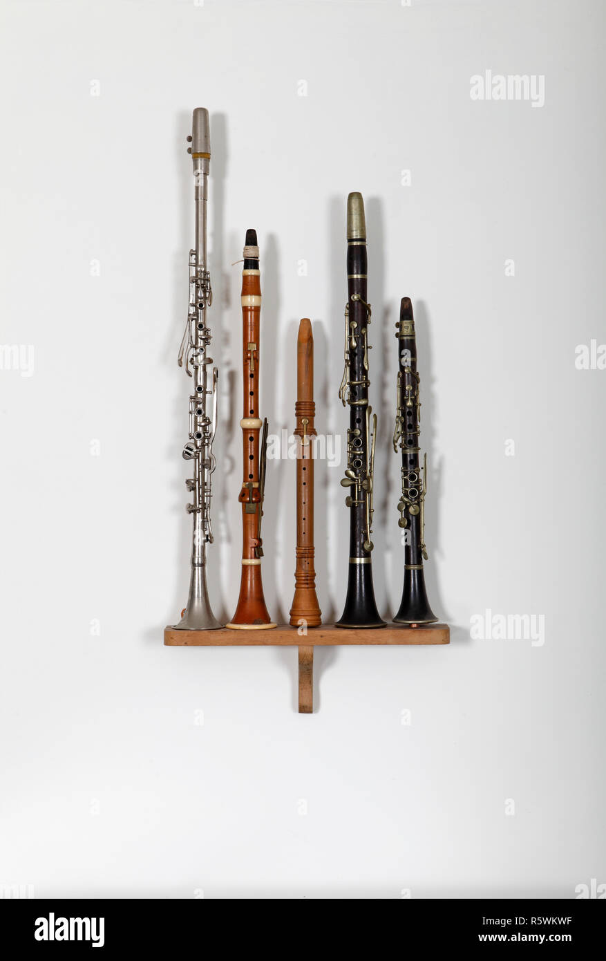 Collection of 5 clarinets from across the ages, including a modern Turkish clarinet. Stock Photo