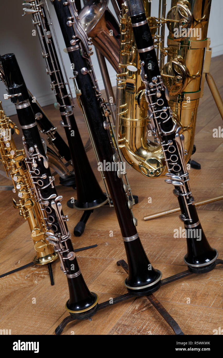 Collection of woodwind instruments, clarinets and saxophones, Wooden and metal instruments Stock Photo
