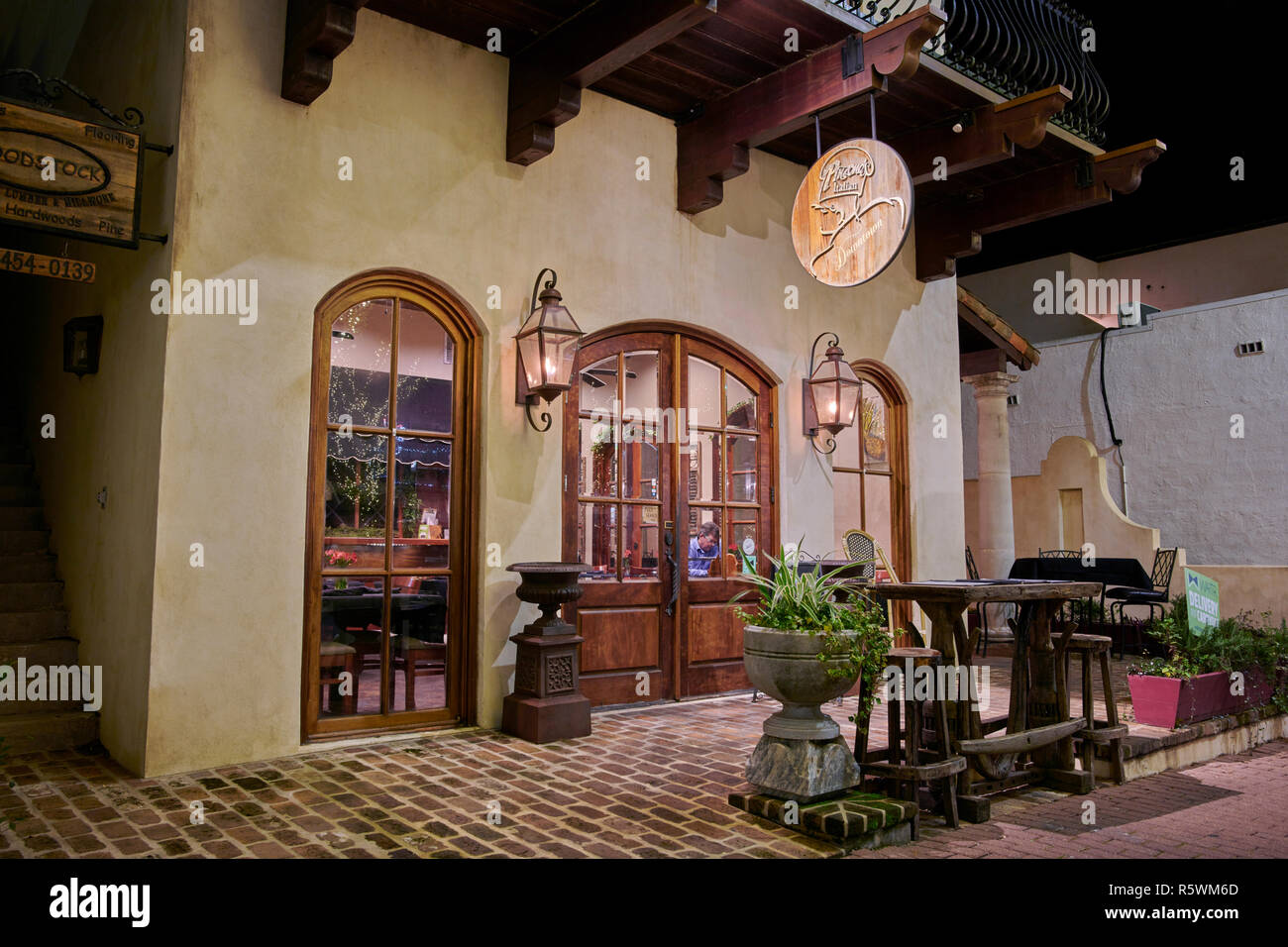 Italian Downtown restaurant front exterior entrance at night in Fairhope Alabama, USA. Stock Photo