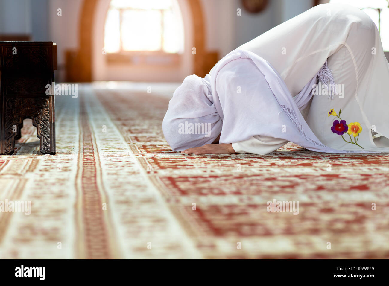 Woman Praying On Her Knees