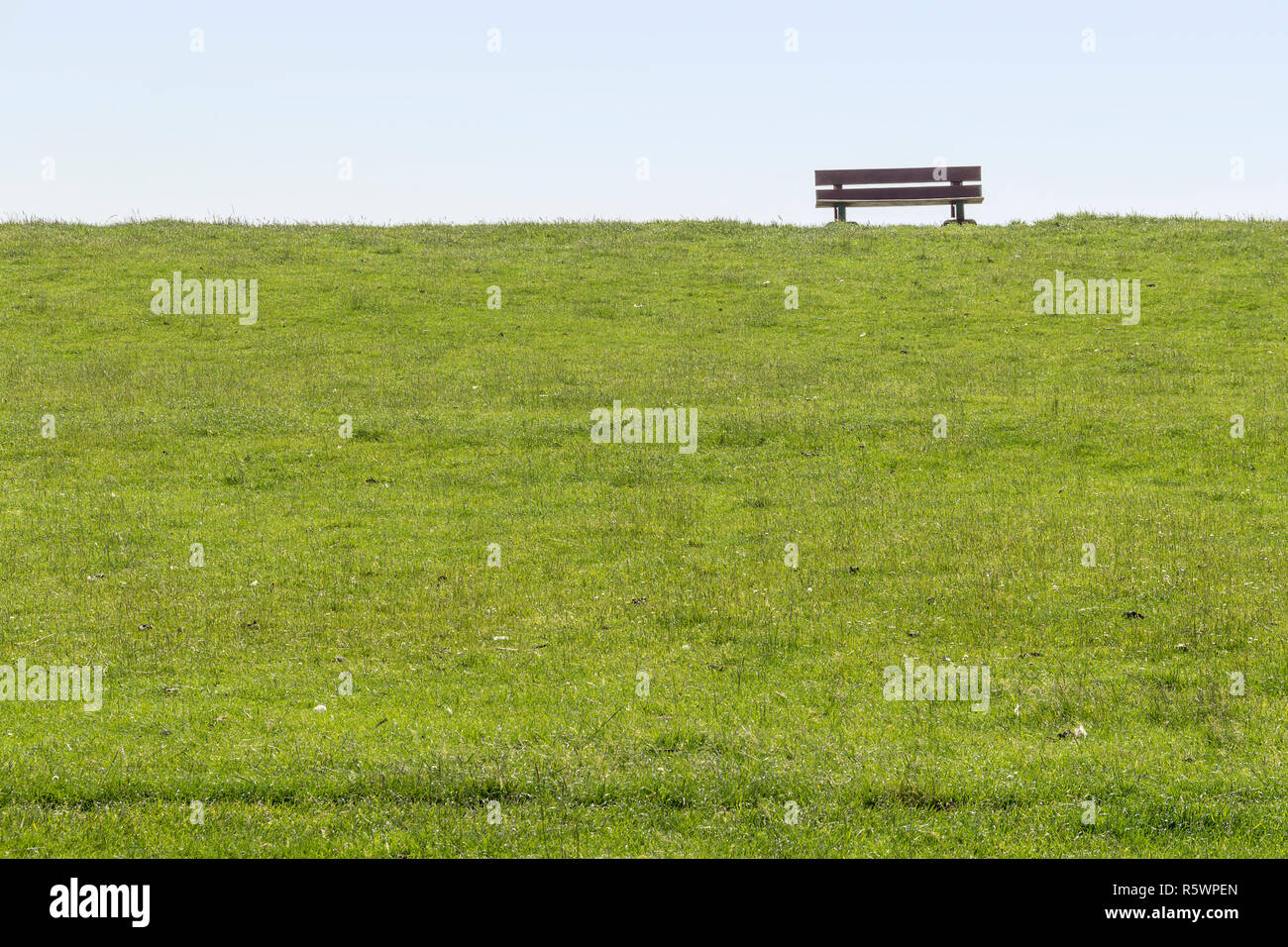 dam with bench around buesum Stock Photo