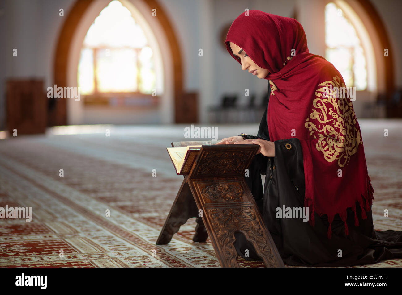 Woman Praying On Her Knees