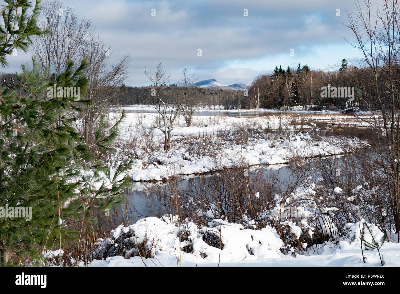 A winter landscape or snowscape of the Sacandaga River valley near Speculator, NY USA in the Adirondack Mountains. Stock Photo