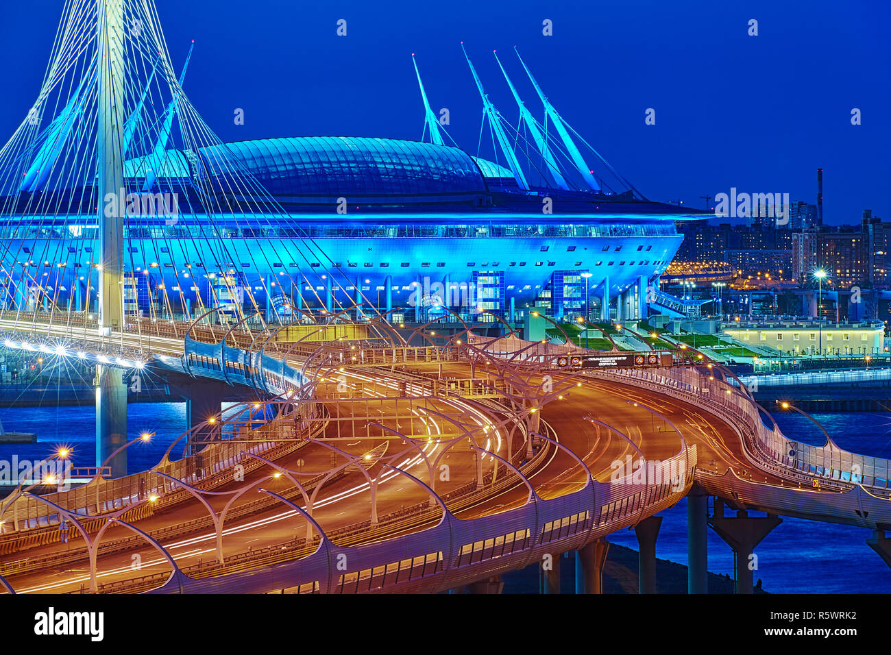 St. Petersburg, Russia - August 22, 2018: Saint Petersburg Arena, where the World Cup was and cable-stayed bridge in blue hour. Stock Photo
