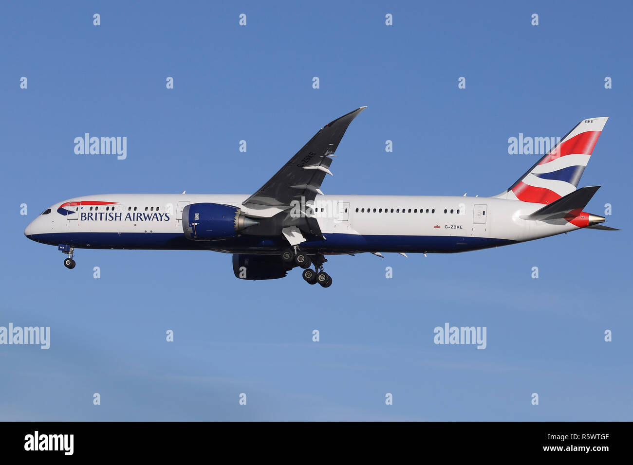 British Airways Boeing 787-9 Dreamliner seen landing at the London Heathrow Airport on a sunny day in December. The aircraft's registration is G-ZBKE and was arriving from Los Angeles, flight BA280. Stock Photo