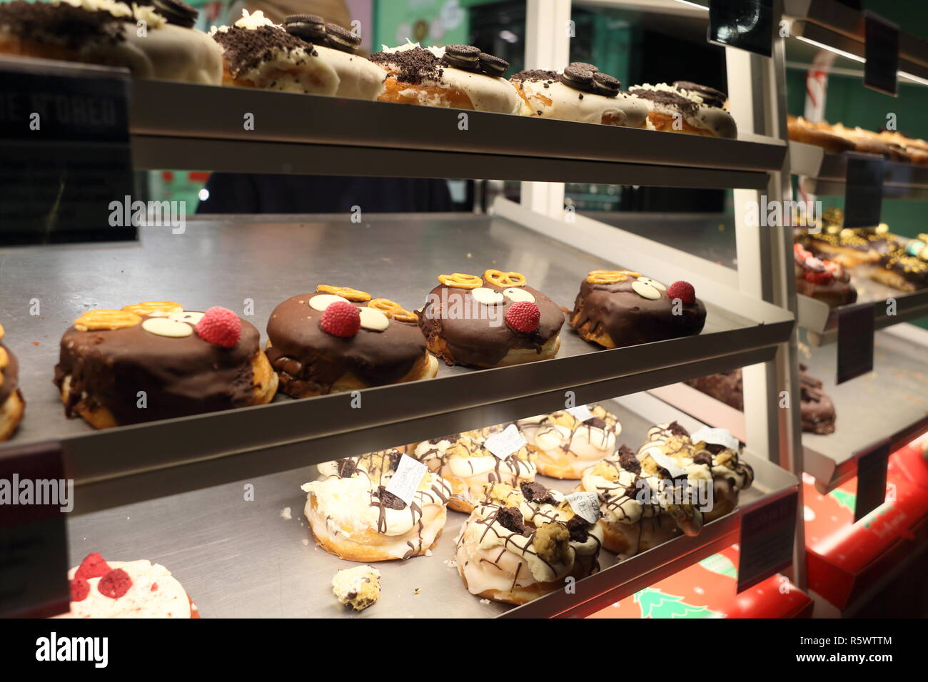 Doughnuts in a bakery window, London, England, UK Stock Photo Alamy