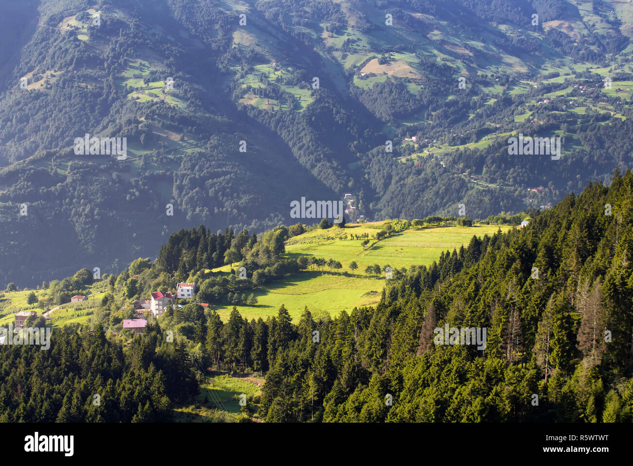 View of high plateau village, mountains, valleys and forest creating beautiful nature scene. The image is captured in Trabzon/Rize area of Black Sea r Stock Photo