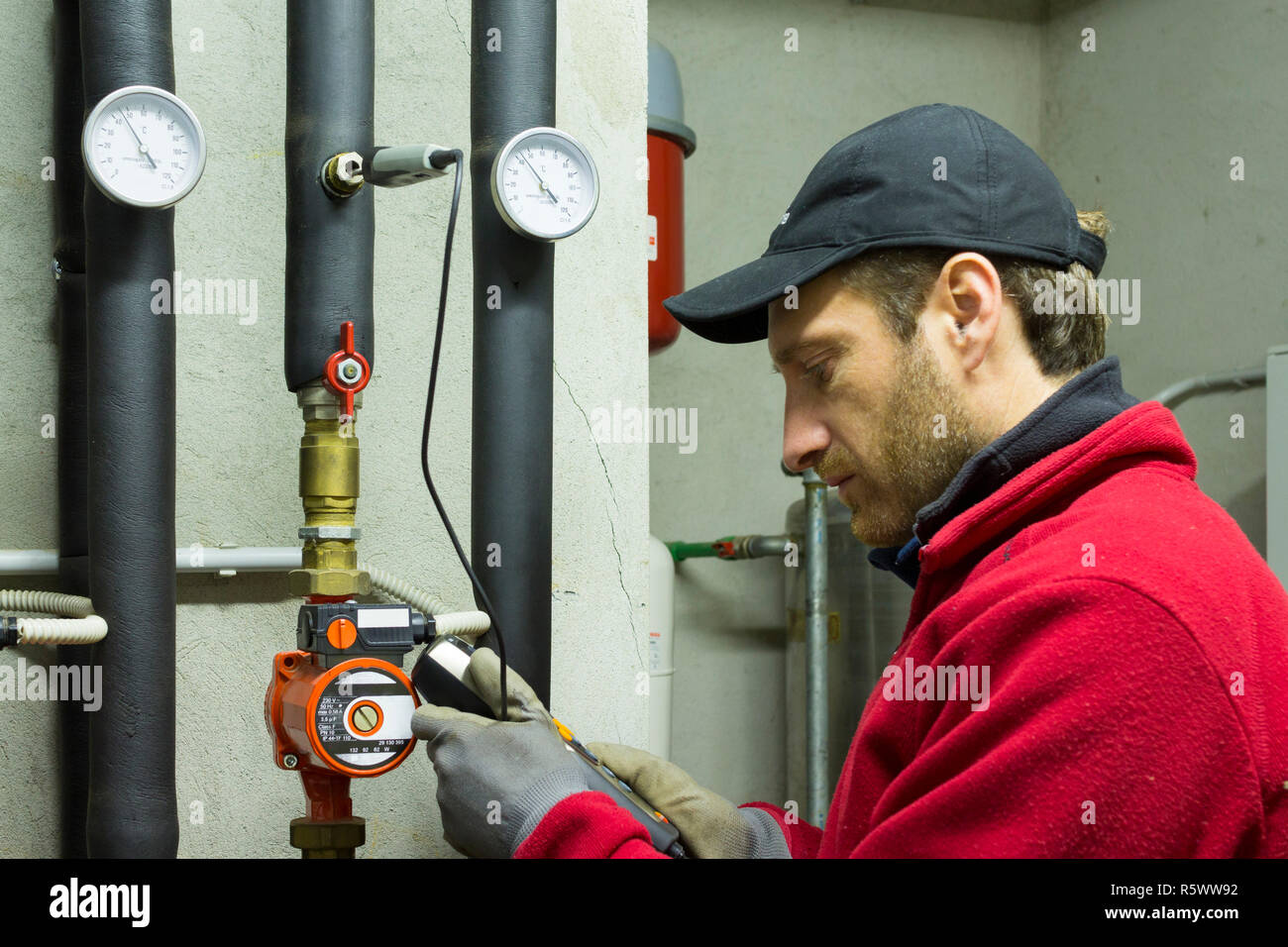 Hydraulic working measures the temperature in a thermal power Stock Photo Alamy