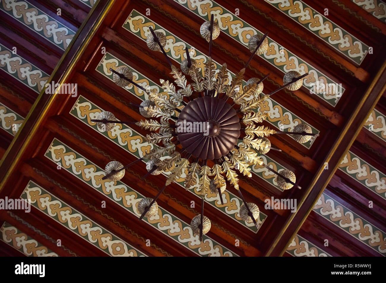BUSTENI, ROMANIA - NOVEMBER 9, 2018. Indoor of Cantacuzino Palace in neo-romanian style, Busteni , Prahova , Romania. Wooden ceiling and chandelier. Stock Photo