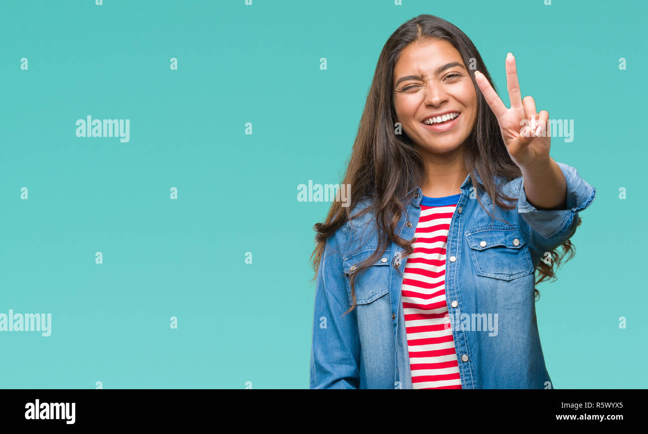 Young beautiful arab woman over isolated background smiling with happy ...
