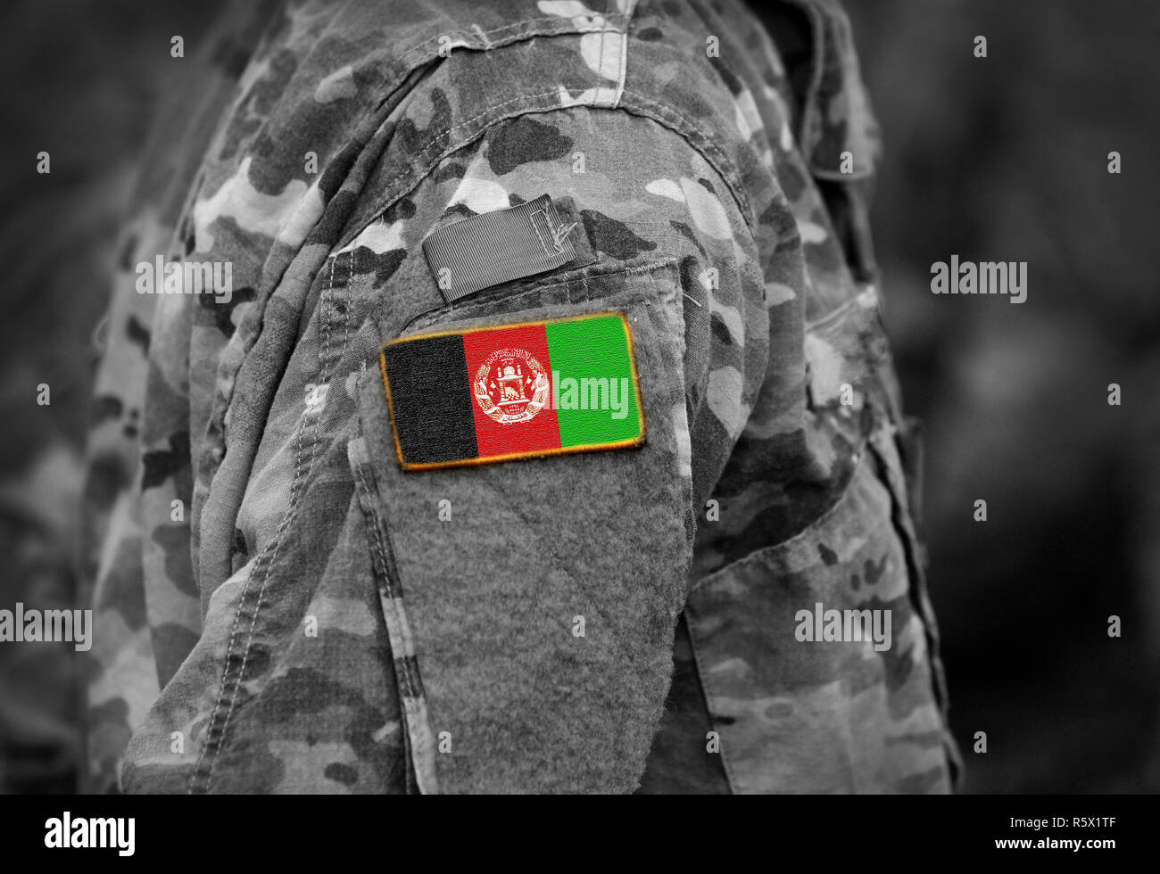Flag of Afghanistan on soldiers arm (collage). Stock Photo