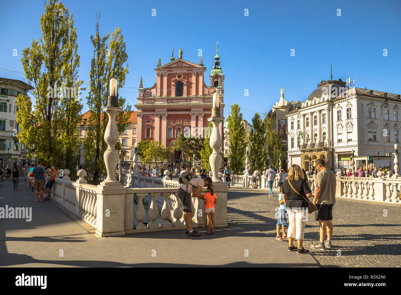 LJUBLJANA, SLOVENIA, AUGUST 11 2017: Tromostovje square afternoon view with tourist activity, Ljubljana, capital of Slovenia Stock Photo