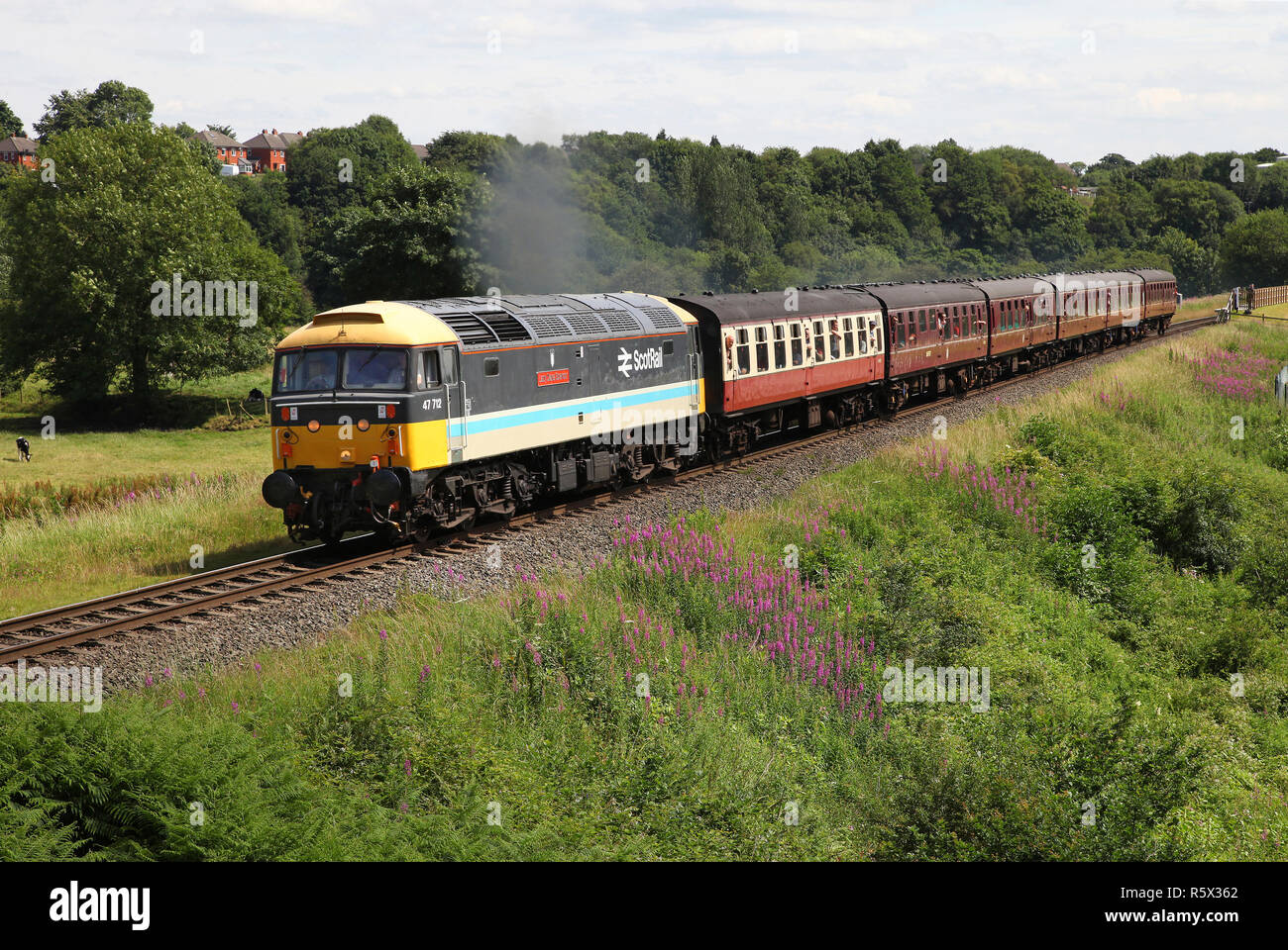 Scotrail liveried 47712 heads past Burrs on the East Lancs Railway. Stock Photo