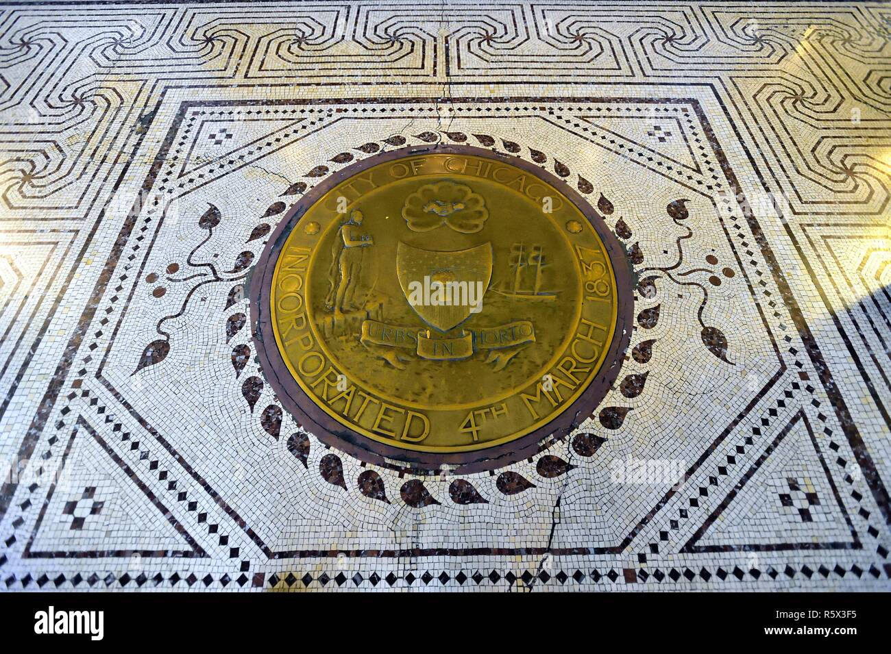 Chicago, Illinois, USA. Detailed, inlaid tile flooring that includes a seal of the City of Chicago near an entrance to the Chicago Cultural Center. Stock Photo