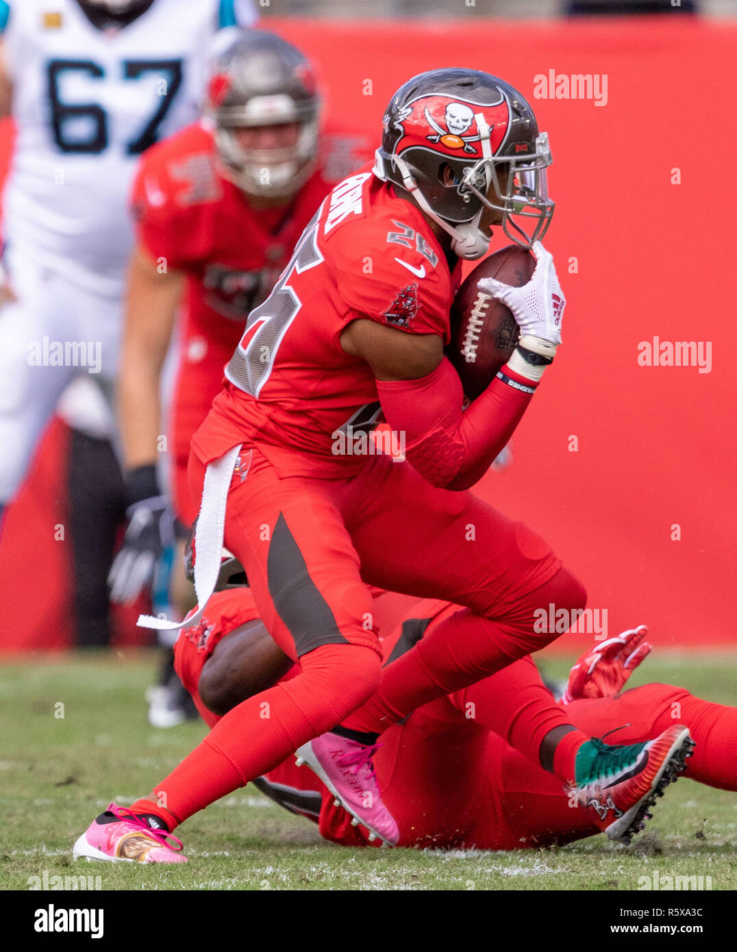 Tampa, Florida, USA. 02nd Dec, 2018. Tampa Bay Buccaneers defensive back Andrew Adams (26) with an interception in the 1st quarter during the game between the Carolina Panthers and the Tampa Bay Buccaneers at Raymond James Stadium in Tampa, Florida. Del Mecum/CSM/Alamy Live News Stock Photo