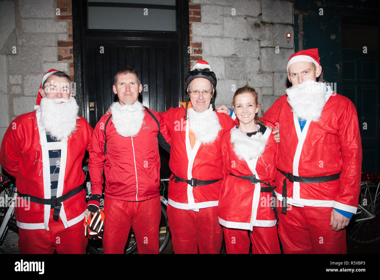 Cork, Ireland. 02nd December, 2018. Pat O'Sullivan, Brian O' Halloran, Tom Noonan, Linda Kellegher and Ronan Geary who took part in the Santa Cycle to raise funds for the medical support group Straight Ahead which provides surgery, support and medical equipment for children with orthopaedic conditions in Cork, Ireland. Credit: David Creedon/Alamy Live News Stock Photo