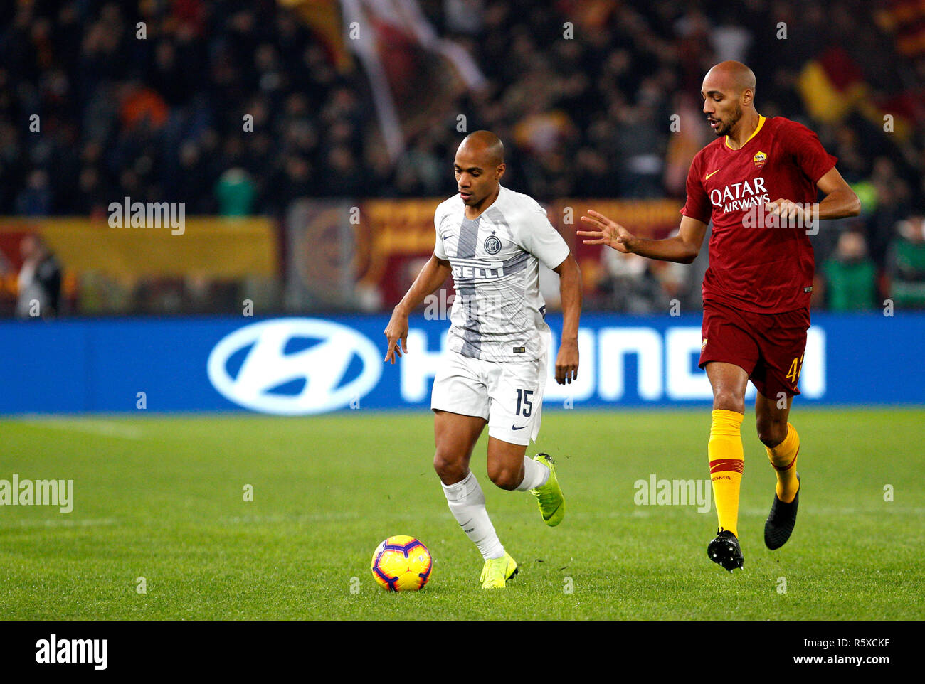 Rome, Italy. 2nd Dec, 2018. Inter's Joao Mario, left, is chased by Roma's Steven Nzonzi during the Serie A soccer match between Roma and Inter at the Olympic Stadium. Credit: UPDATE IMAGES/ Alamy Live News Stock Photo