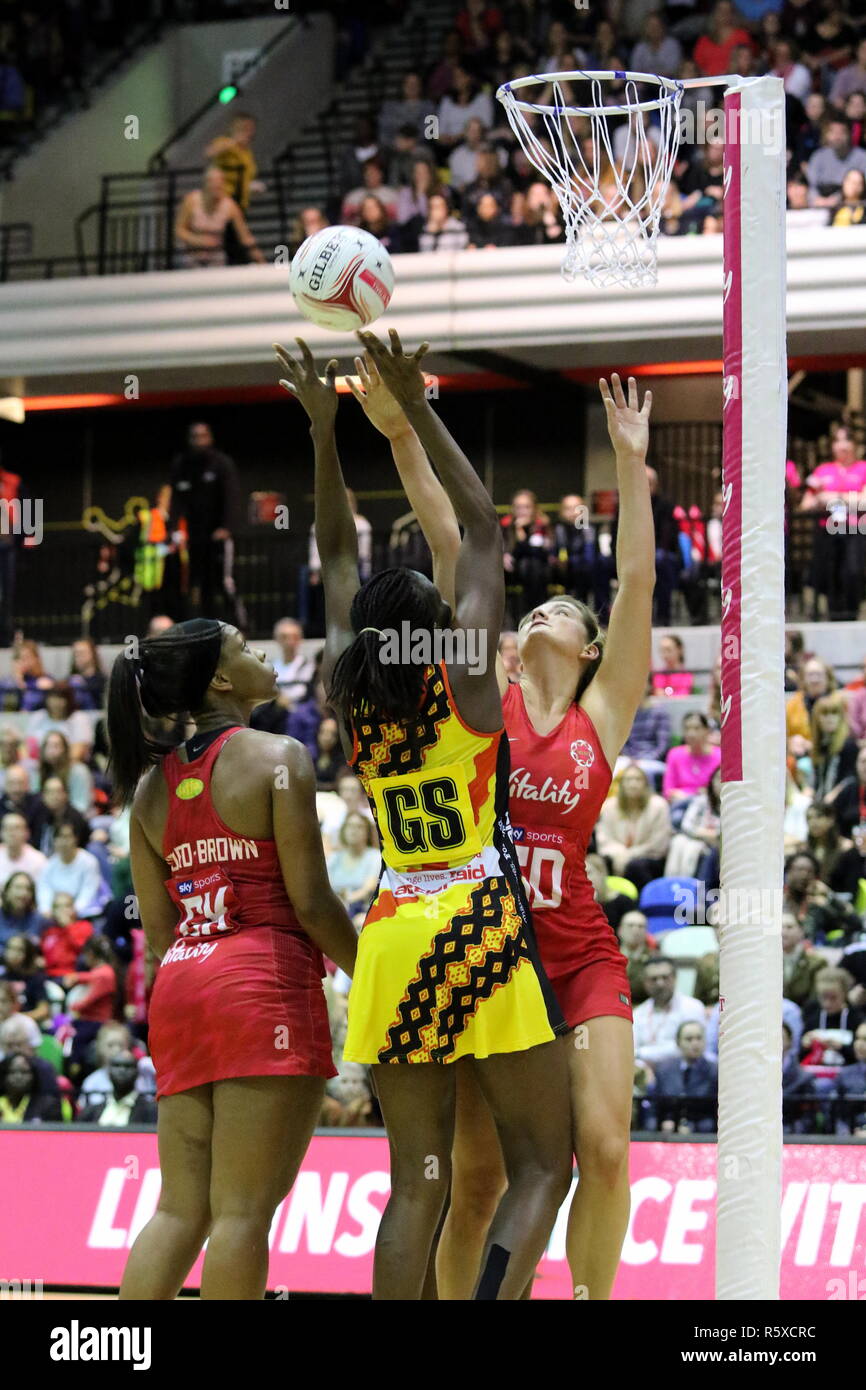LONDON, UK. 2nd Dec, 2018. Reaching for the rebound in The Vitality Netball  International Series match between England and Uganda at the Copper Box  Arena on December 2, 2018 in London, England,