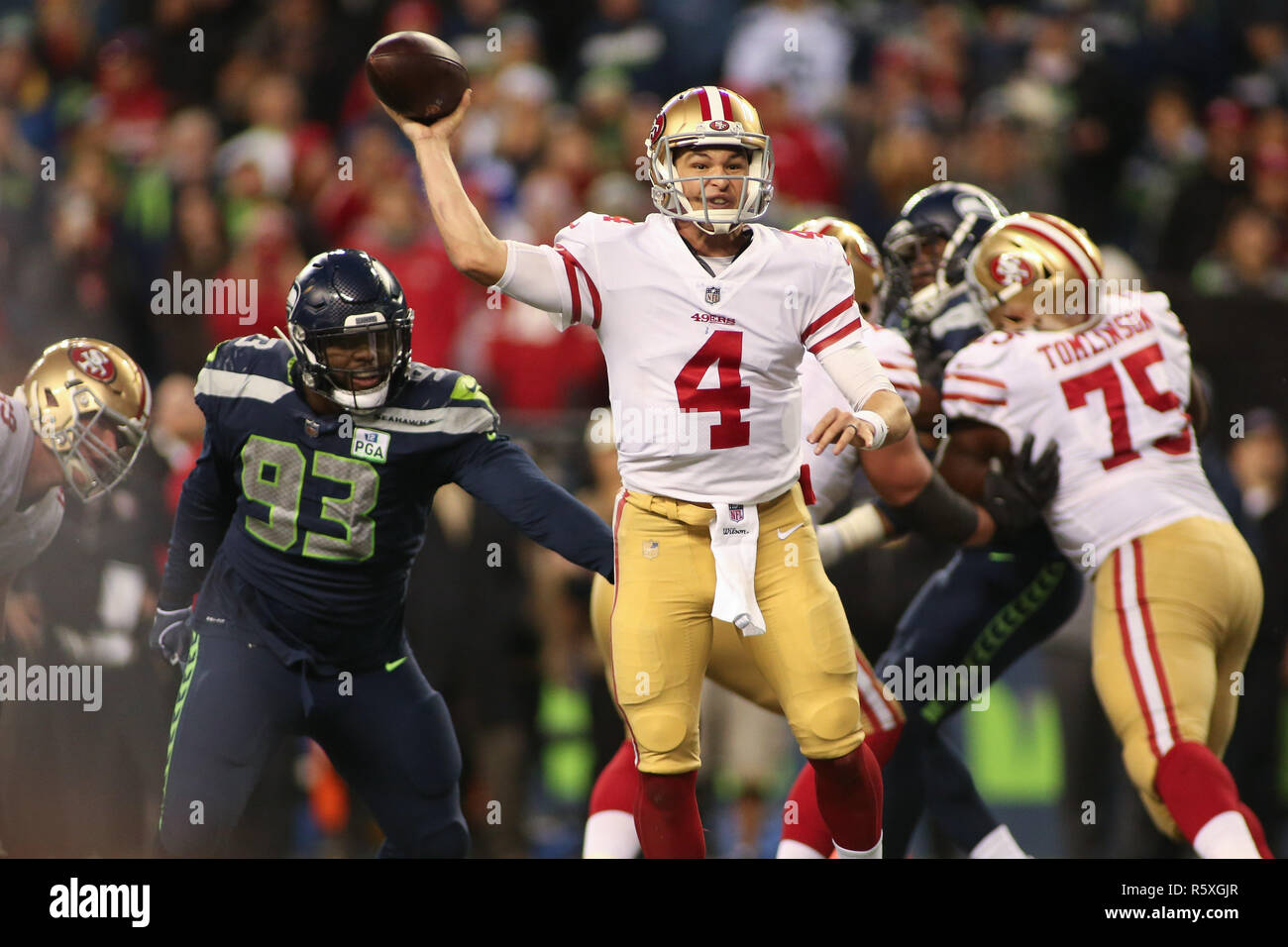Seattle, WA, USA. 2nd Dec, 2018. San Francisco 49ers quarterback Nick Mullens (4) escapes the pressure in the pocket during a game between the San Francisco 49ers and the Seattle Seahawks at CenturyLink Field in Seattle, WA. Seahawks defeat the 49ers 43-16. Sean Brown/CSM/Alamy Live News Stock Photo