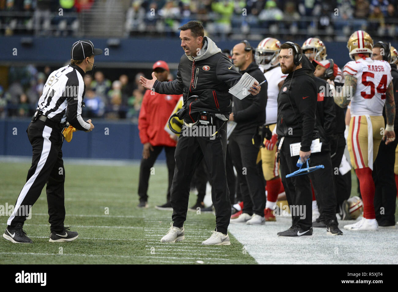 Seattle, Washington, USA. 2nd Dec, 2018. NFL 2018 - 49er Head Coach KYLE SHANAHAN voices his opinion to Line Judge WALT COLEMAN (87) during an NFL game between San Francisco and Seattle at Century Link Field in Seattle, WA. Credit: Jeff Halstead/ZUMA Wire/Alamy Live News Stock Photo