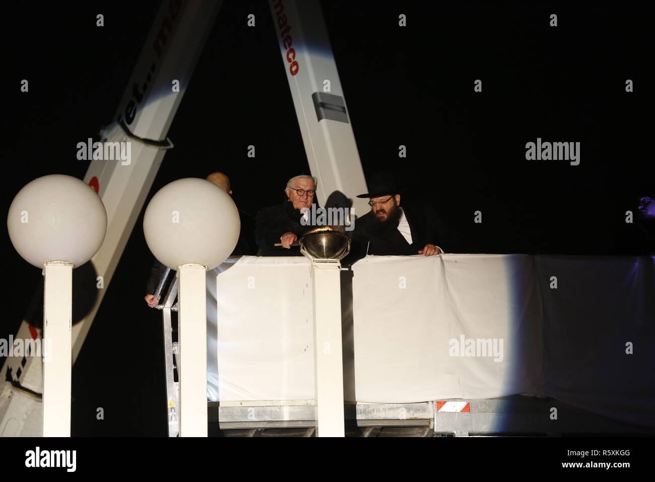 Berlin, Germany. 02nd Dec, 2018. Federal President Frank-Walter Steinmeier and Rabbi Teichtal lighting the ten-meter-high Hanukkah lamp in front of the Brandenburger Tor. On Sunday evening, December 2, 2018, Hanukkah will begin this year. The Jewish Education Center Chabad Berlin begins this eight-day Jewish festival of lights at the Brandenburger Tor. Credit: SAO Struck/Alamy Live News Stock Photo