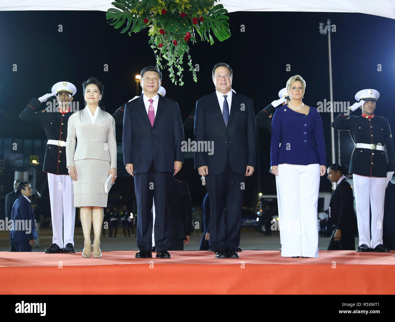 Panama City, Peng Liyuan (1st L Front). 2nd Dec, 2018. Chinese President Xi Jinping (2nd L Front), his wife Peng Liyuan (1st L Front), Panamanian President Juan Carlos Varela (2nd R Front) and his wife Lorena Castillo Garcia (1st R Front) attend a grand welcoming ceremony Juan Carlos Varela held for Xi Jinping in Panama City Dec. 2, 2018. President Xi Jinping arrived here on Sunday for a state visit to Panama. Credit: Xie Huanchi/Xinhua/Alamy Live News Stock Photo